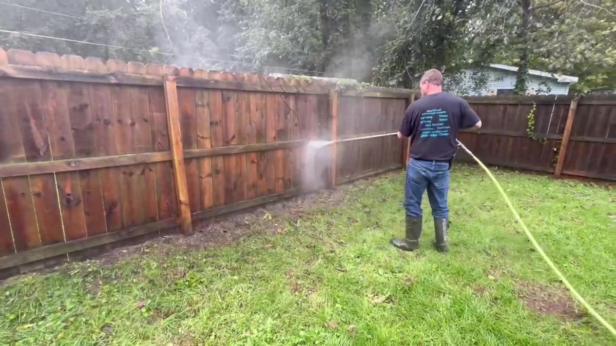 Washing a long wood fence