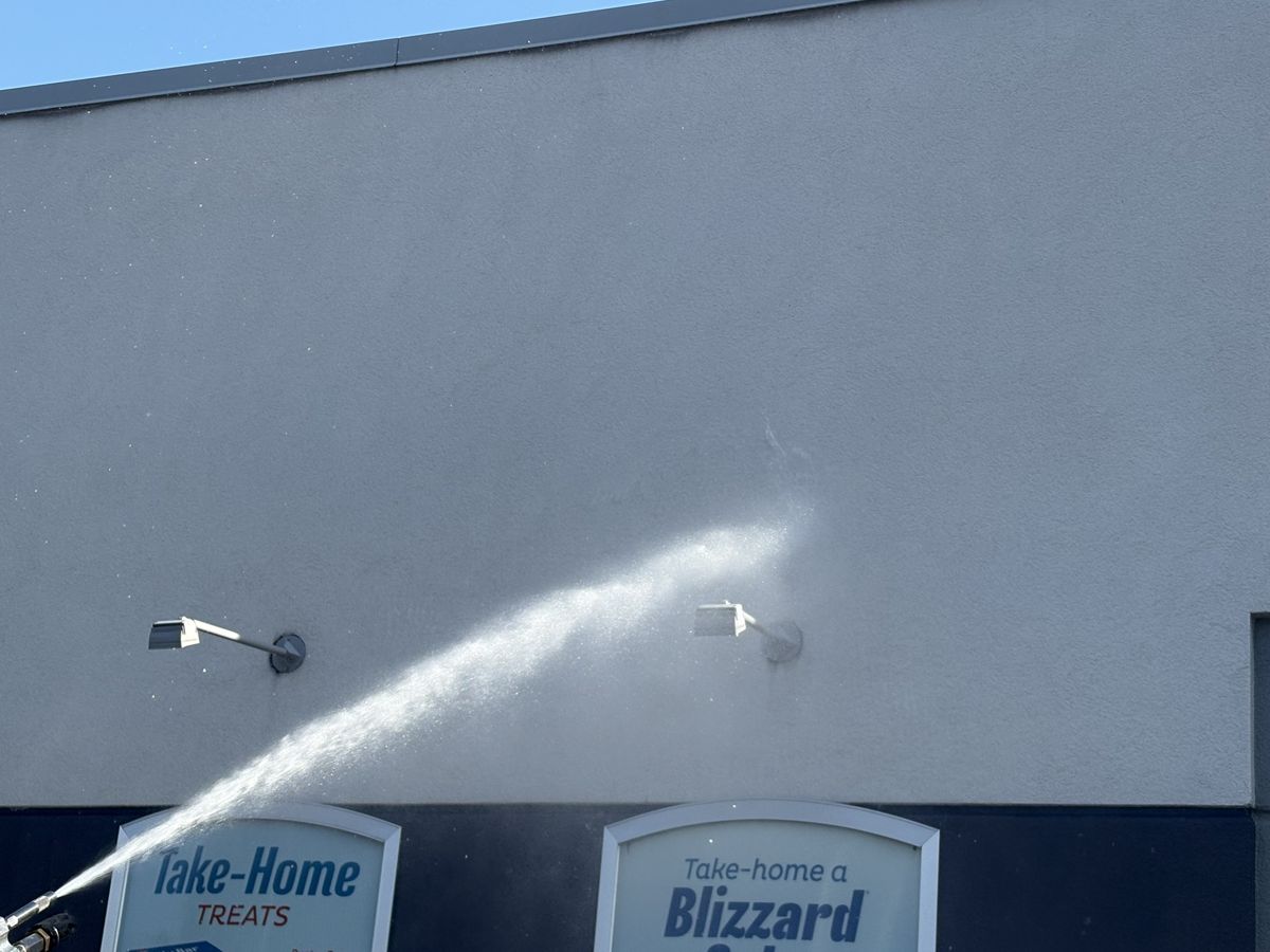 Washing a commercial wall